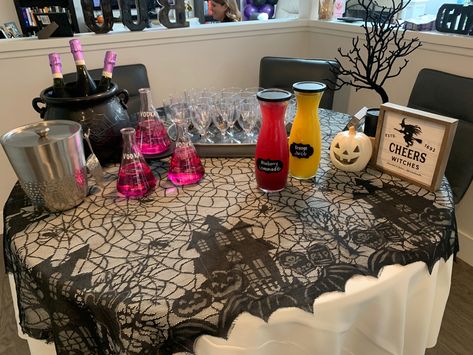 Halloween Drink Bar Ideas, Halloween Potion Drinks, Spooky Mimosa Bar, Spooky Wedding Shower Ideas, Potion Bar, Halloween Mimosa Bar, Stock The Bar Halloween Party, Spooky Bridal Shower Decorations, Halloween Bar Setup