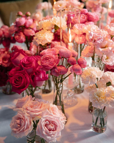 A beautiful round table centerpiece featuring an array of pink blooms in various shades, perfect for a girl's birthday party. The arrangement combines soft blush roses, vibrant peonies, and delicate carnations, creating a harmonious blend of pink tones. This elegant centerpiece adds a touch of sweetness and charm to the celebration, making the table truly special. Pink Flower Centerpieces, Pink Flower Arrangement, Round Table Centerpiece, Wedding Yacht, Pink Flower Arrangements, Elegant Centerpiece, Bouquet Delivery, Pink Rose Bouquet, Elegant Centerpieces