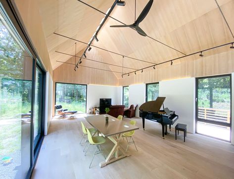 Living Room, Light Hardwood Floor, Chair, and Track Lighting The great room feels larger than it actually is, thanks to its vaulted ceiling and ample glass. Clad Home, Huge Houses, Oak Plywood, Light Hardwood, Light Hardwood Floors, Exclusive Home, Old Wall, Barn Lighting, Architecture Old