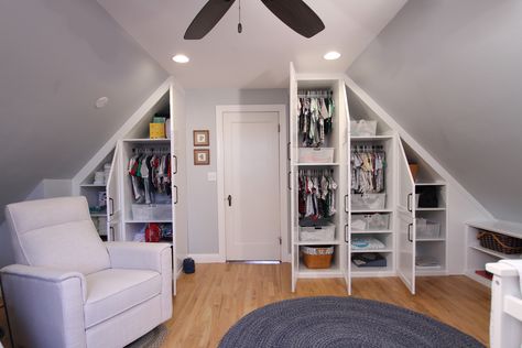 This client emailed to tell me how much she LOVES her custom painted wood cabinetry! "I knew I would love them, but they exceeded my expectations." Before, this was an upstairs room with a slanted ceiling and NO closet. Now she has a place for everything in her baby's new nursery. Awwww. 💗  #nursery #builtins #closedstorage #woodcabinetry #wardrobecabinets #functional #bookshelf #woodproject #beautifulspaces #designer #aplaceforeverything #closetgoals #newspace Contact: MelissaM@NewSpace.com Closet Ideas With Slanted Ceiling, Nursery With Slanted Walls, Attic Bedroom Slanted Ceiling, Low Vaulted Ceiling Bedroom Attic Rooms, Long Narrow Attic Bedroom, Minimalist Bedroom Slanted Ceiling, Slop Ceiling Bedroom Ideas, Upstairs Room With Slanted Ceiling, Slanted Ceiling Bedroom Kids