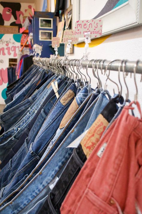 Thrift Store Display Ideas Resale Shop, Pants Display Ideas, Pant Display Retail, Garage Sale Hanging Clothes Ideas, How To Display Jeans In A Boutique, Vintage Clothing Display Flea Markets, Boutique Jean Display, Thrift Booth Display Ideas, Diy Clothes Rack For Flea Market