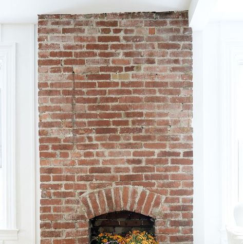 empty fireplace with flowers Closed Fireplace Decor, No Fire Fireplace, Blocked Fireplace Ideas, Fireplace Without Fire, Closed Off Fireplace Ideas, No Mantel Fireplace Ideas, Nonfunctional Fireplace Ideas, Disused Fireplace Ideas, No Mantle Fireplace