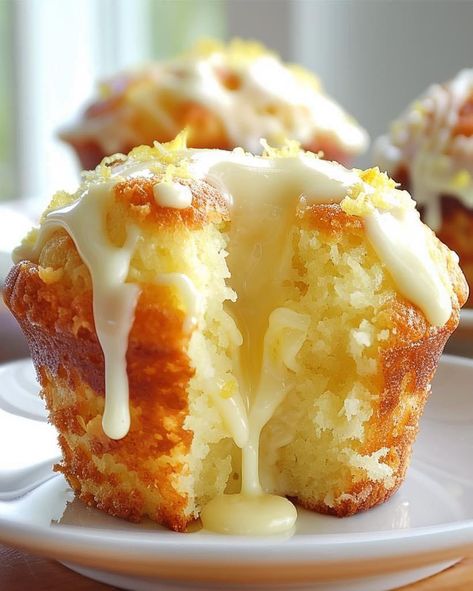 ￼   Luscious Lemon Cream Cheese Muffins 😋🍋🧁 Ingredients: For the Muffins: 2 cups all-purpose flour 1 cup granulated sugar 1 tsp baking powder 1/2 tsp baking soda 1/4 tsp salt 1/2 cup unsalted butter, melted 1 cup buttermilk 2 large eggs 1 tsp vanilla extract Zest of 2 lemons Juice of 1 lemon For the Cream Cheese Filling: 8 oz cream cheese, softened 1/4 cup granulated sugar 1 tsp vanilla extract For the Lemon Glaze: 1 cup powdered sugar 2 tbsp lemon juice Zest of 1 lemon Directions: Preheat oven to 350°F (175°C). Line a muffin tin with paper liners. In a large bowl, whisk together flour, sugar, baking powder, baking soda, and salt. In another bowl, combine melted butter, buttermilk, eggs, vanilla extract, lemon zest, and lemon juice. Pour the wet ingredients into the dry ingredients and Luscious Lemon Cream Cheese Muffins, Lemon Cream Cheese Muffins, Optimal Recipes, Lemon Cream Cheese, Cream Cheese Muffins, Lemon Muffins, Homemade Muffins, Cheese Muffins, Cheesecake Desserts