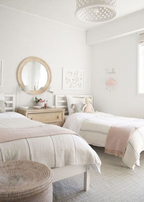 Are you looking to design a shared bedroom for your darling girls? We've rounded up the prettiest shared girls rooms for you. 2 Bed 1 Room Ideas, White Twin Bed Girls Room, Shared Girls Room Twin Beds, 2 Beds Girls Room, Two Beds Room Ideas, White Twin Bedroom Ideas, Room Ideas For Two Beds, Girls Room 2 Twin Beds, Girls Room With Two Twin Beds