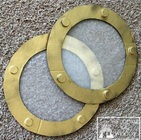 Cardboard Ship Wheel & Fake Portholes                                                                                                                                                                                 More Diy Porthole Window, Diy Pirate Wheel, Diy Pirate Ship Wheel, Diy Pirate Ship Cardboard, Yacht Rock Party Decor, Cardboard Pirate Ship Diy, Pirate Props Diy, Cardboard Waves, Porthole Painting