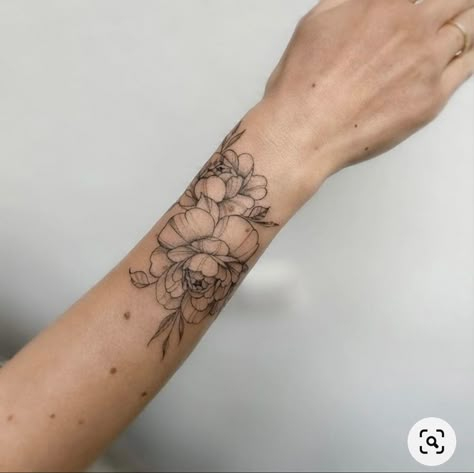 Flower Tattoo Placement For Women, Floral Forearm Cuff Tattoo, Peony Arm Band Tattoo, Womens Wrist Tattoos, Floral Upper Arm Cuff Tattoo, Tattoo Flower Bracelet Wrist, Delicate Wrist Bracelet Tattoos For Women Floral, Wrap Tattoos For Women, Floral Hip Tattoo