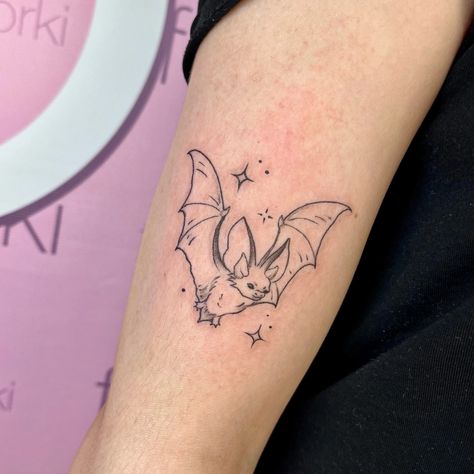 Bat Tattoo Above Knee, Simple Alt Tats, Tiny Bat Tattoo Outline, Simple Goth Tattoos For Women, Final Destination Tattoo, Dainty Bat Tattoo, Small Bat Tattoo Simple, Fine Line Bat Tattoo, Small Bat Tattoo Ideas