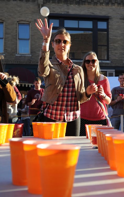 Lina Rylander throws a ping pong ball into a cup during a beer pong game at Oktoberfest in downtown Ames on Saturday, Oct. 12. Photo by Nirmalendu Majumdar/Ames Tribune Ping Pong Cup Game, Oktoberfest Games, Fall Beers, Ping Pong Games, Beer Games, Pagan Holidays, Pong Game, Beer Photography, Beer Friends