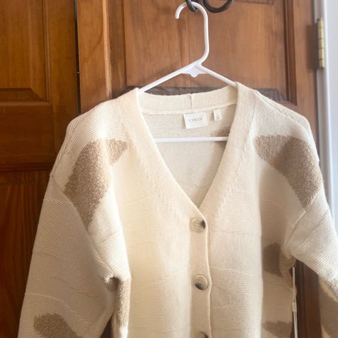 Embrace Warmth And Style With The Cyrus Cardigan, Featuring A Cozy Knit Texture In A Chic Cream And Tan Palette. This Versatile Piece Is Perfect For Layering, Offering A Classic V-Neck Design That Complements Your Beautiful Face. Knit Texture, Knit Cardigan Sweater, Cozy Knit, Cozy Knits, Knit Sweater Cardigan, Neck Designs, Cardigan Sweater, Knit Cardigan, Sweaters & Cardigans