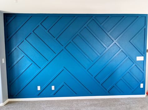 Painted with sherwin williams deep ocean blue. Geometric Wood Feature Wall, Geometric Trim Accent Wall, Teal Geometric Wall, Blue And Purple Geometric Wall, Geometric Blue Wallpaper Accent Walls, Flooring On Walls, Wooden Accent Wall, Memorial Markers, Blue Accent Walls