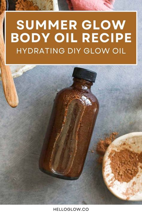 A dark amber glass bottle of homemade body oil sits on a gray surface next to a dish of bronzing powder, with a wooden spoon nearby for a DIY beauty aesthetic. Body Oil For Glowing Skin, Diy Body Oil, Body Oil Recipe, Oil For Glowing Skin, Homemade Lip Balm Recipe, Natural Skincare Recipes, Diy Glow, Shimmer Body Oil, Lip Balm Recipes