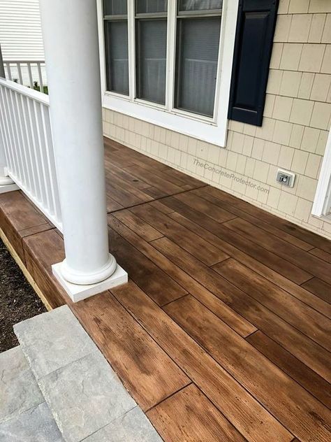 An image of a concrete porch made to look like hardwood. Concrete Front Steps, Double Wide Remodel, Mountain Home Exterior, Porch Wood, Wood Porch, Concrete Patio Designs, Concrete Resurfacing, Painted Front Porches, Concrete Coatings