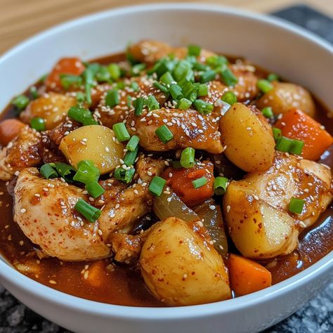 🌶️ "Spice up your dinner with this hearty and flavorful Spicy Korean Chicken Stew!" 🌶️🍗 #KoreanChicken #SpicyFood Spicy Korean Chicken Stew Ingredients: Chicken pieces (1 lb) Gochujang (3 tbsp) Soy sauce (2 tbsp) Garlic (4 cloves, minced) Onion (1, sliced) Potatoes (2, chopped) Carrots (2, chopped) Green onions (for garnish) Water (2 cups) Sesame oil (1 tbsp) Instructions: In a pot, sauté garlic and onion in sesame oil until fragrant. Add chicken pieces and cook until lightly browned. Sti... Korean Chicken Stew, Spicy Korean Chicken, Korean Chicken, Instagram Recipes, Spicy Korean, Chicken Pieces, Chopped Carrots, Trending Recipes, Chicken Stew