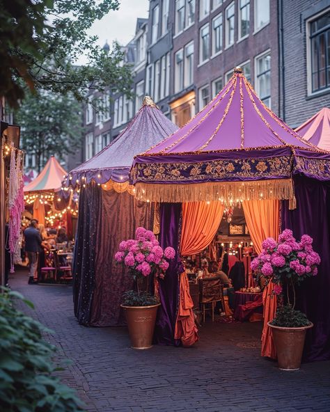 Currently taking place in Amsterdam is the festival Sleepover City, where residents invite each other to stay overnight in their homes or in tents in their front gardens. The entire city is decorated in purple, pink, and orange to indicate which houses offer a sleeping spot. In this festive spirit, residents move from tent to tent to visit each other, enjoy delicious food made by locals, and toast together. AI-generated, retouched and enhanced in post-production by @noellevandijk. — Part of ... Event Place Design, Market Desserts, Arabian Tent, Festival Tent, 100 Years Celebration, Moroccan Tent, Arabian Decor, Pink Tent, Tent Party