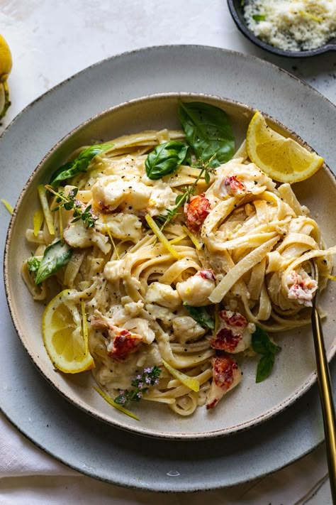 Creamy Lemon Pasta with Lobster is the ultimate date-night-in meal. It starts by poaching lobster tails in white wine & thyme, and ends with a simple, creamy lemon infused sauce. For a creamy pasta dish, it's rich, as to be expected, but still light enough in flavor to be perfect for summer! Especially with a crisp glass of white wine or rosé! #lobster #pasta #lemon #datenight #dinner Pasta With Lobster, Pasta With Lemon Sauce, Pasta Lemon, Creamy Lemon Pasta, Cabo Trip, Seafood Lobster, Fettuccine Recipes, Lobster Pasta, Meal Calendar