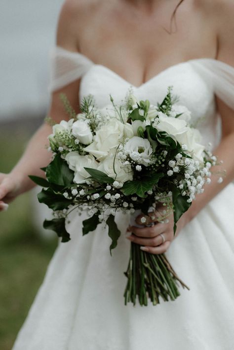 Hand-tied Bridal Bouquet in cool whites and dark green designed by Justine, Oban Florist, The Thistle & The Rose White Bride Flower Bouquet, All White And Green Bouquet, Dark Green Wedding Flowers Bouquets, White And Green Hand Tied Bouquet, Dark Green Flowers Wedding, White And Green Simple Bouquet, Bridal Flowers Bouquet White And Green, Flowers For Dark Green Wedding, Wedding Bouquets White And Green Simple