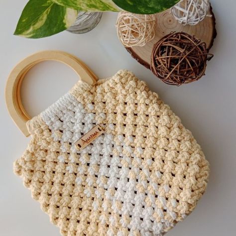 Level up your style with our Handmade Premium Luxury Bags! 🧳 Sample image from Pinterest, but trust us, our bags are even more stunning! Order now and get a handmade crochet bag that's tailored to your taste! Our skilled artisans pour love and care into each piece, and we'll send you a preview before shipping. Customization available! Choose your favorite colors, sizes, and styles to make it extra special. Our bags feature: - High-quality materials - Unique designs - Premium luxury feel ... Macrame Handbag, Macrame Bags, Basket Style, Handmade Crochet Bags, Thread Art, Macrame Bag, Boho Bags, Cloth Bag, Bamboo Handles