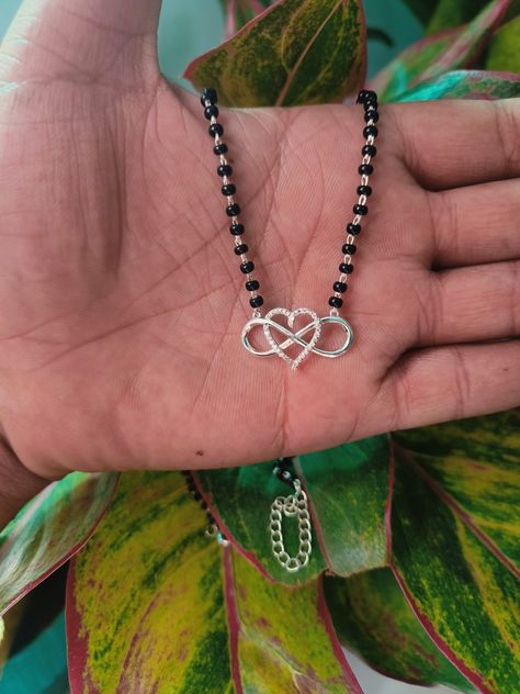 A "heart infinity CZ silver mangalsutra" is a type of necklace, typically worn by married women in India as a symbol of their marital status and commitment Infinite Heart, Infinity Heart, Zircon Jewelry, Endless Love, Married Woman, Black Beads, Beaded Chain, Pendant Necklace, Chain