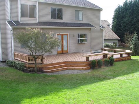 Trex deck and benches in Kirkland Deck With Partial Railing, Deck Off Back Of House Farmhouse, Back Deck Decor Ideas, Deck Ideas New Zealand, Ground Level Deck Ideas, Patio Deck Decorating Ideas, Back Deck Decor, Deck Ideas Backyard, Floating Deck Ideas