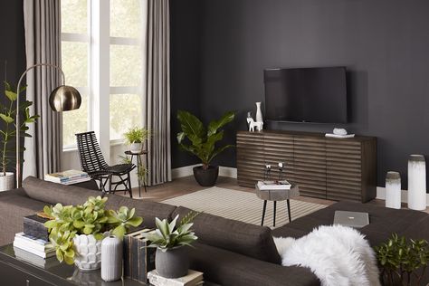 A dark paint color behind your TV can downplay the role your TV plays in your décor - virtually making it disappear into the wall. Wall Behind Tv, Small Tv Room, Wall Trends, Dark Paint, Wood Accent Wall, Dark Wall, Living Room Tv Wall, Dark Walls, Best Paint Colors