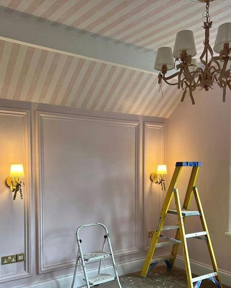 Stephanie Moreton on Instagram: "CANDY STRIPES 💕 As soon as I saw this vaulted ceiling I knew I wanted to wallpaper the whole area!! Thankfully the client loved the idea as much as me!!! …this is going to be something special….lots more to add including custom blinds 💕 . . . . . #pink #pinkbedroom #girlsbedroom #girliebedroom #stripedwallpaper #walllights #chandelier #panelling #wallpanelling #bedroom #bedroominspo #design #designinspo #designservice #homedesign #homeinspo #beverleyhillshotel Wainscoting Slanted Ceiling, Pink Ceiling White Walls, Angled Ceiling Wallpaper, Vaulted Ceiling Wallpaper, Painted Ceiling Kids Room, Nursery Ceiling Wallpaper, Wallpanelling Bedroom, Striped Wallpaper Ceiling, Ceiling Wallpaper Bedroom