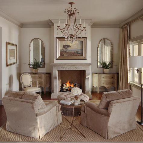 A sense of symmetry brings out the natural beauty in the sitting room. On either side of the fireplace, distressed demilune consoles and stylized mirrors have an old but new quality. The ceiling is a few shades darker than the walls, which adds a coziness to the elegant space. Piano Space, Bathroom Country, Fireplace Sitting Area, Accountable Talk, Fireplace Seating, Country Family, Cream Room, Bedroom With Sitting Area, Ideas Hogar