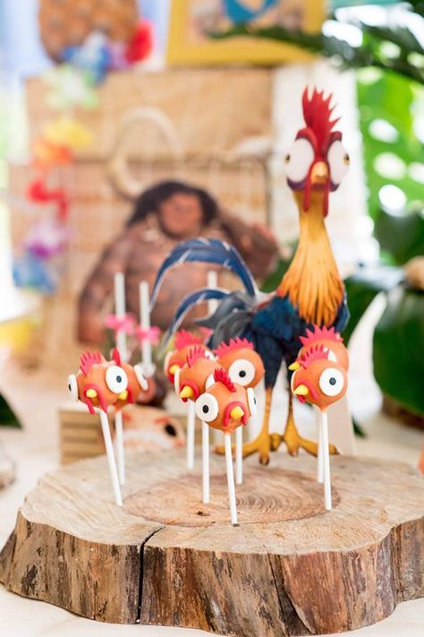 Moana Party | CatchMyParty.com Maui Moana Birthday Party Ideas, Moana First Birthday Cake Smash, Moana Birthday Party Treats, Two Year Old Moana Birthday Party, Moana Sweet Table Ideas, Tropical Food For Party, First Birthday Moana Theme, Birthday Moana Party Ideas, Moana Table Set Up