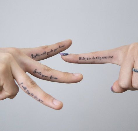 Learn all about finger and hand tattoos: Healing, pros and cons, tips, and design options. Words On Fingers Tattoo, Fonts For Finger Tattoos, Words On Hands Tattoo, Writing On Finger Tattoo, White Ink Finger Tattoo Healed, Finger Tattoo Quotes, Aged Finger Tattoo, Inside Finger Tattoos Men, Word On Finger Tattoo