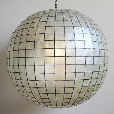 Capiz Shell Globe Lantern.  Intricate cut Capiz Shell with perfect geometry that forms a striking Globe Lantern.  Unique!  Here at design MIX furniture we offer studio rentals of all of our one of a kind pieces. If you have any questions about this piece or any of our art and furnishings please contact us. Capiz Shell, Globe Pendant Light, How To Make Lanterns, Contemporary Pendant Lights, Unique Collectibles, Porch Lighting, Globe Pendant, Globe Lights, Shell Pendant