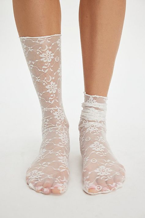 A femme finishing touch to any look, these crew socks are made of a sheer mesh fabrication adorned with floral lace details. **Fit:** Crew length **Features:** Floral lace, sheer mesh fabrication, slouchy **Why We ❤ It:** Pair with ballet flats for a super girly ‘fit. | Ava Lace Socks by High Heel Jungle at Free People in White Frilly Socks And Heels, Girly Fits, Wedding Socks, Sheer Socks, Socks And Heels, Lace Socks, Lavender Wedding, Lace Ruffle, Ankle Socks