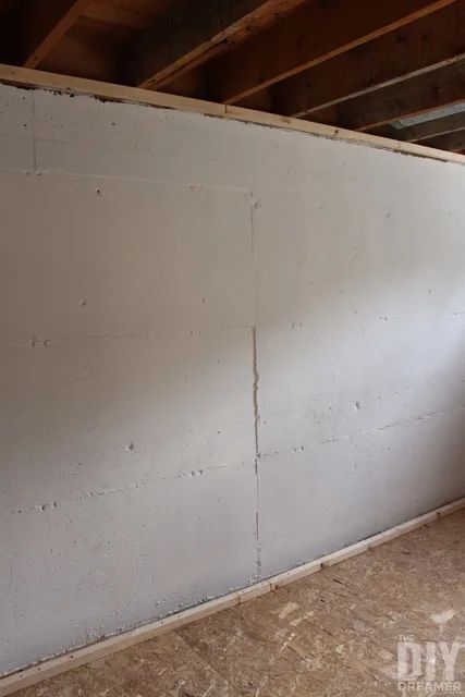 Basement Office Unfinished, How To Seal Basement Walls, Basement Sump Pump Cover Ideas, Block Basement Wall Ideas, Basement Cement Wall Ideas, How To Finish A Basement, Drywall Alternatives For Walls, Basement Wall Ideas Without Drywall, Concrete Basement Wall Ideas