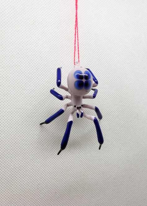 Beautiful model of a handmade Hanging Glass Spider figurine made of blown glass using the lampwork technique (also called glass blowing). Please pay attention at colors of the figurine- we used no paints or decal, only color glass. All shop: https://www.etsy.com/shop/OVGlassArtStudio Follow us: https://www.facebook.com/Aenpu/ https://www.instagram.com/ovglassart/ Ceramic Spider, Glass Blowing Art, Spider Glass, Glass Spider, Handmade Hanging, Blown Glass Art, Handmade Glass Beads, Glass Figurines, Glass Animals