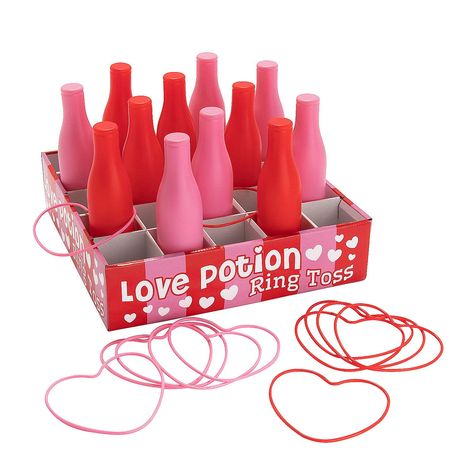 PRICES MAY VARY. Try your luck at love with this fun game! Players try to toss the heart-shaped rings onto the pink and red bottles to earn points. A fun and easy Valentine’s Day party activity, this is a game most kids already know how to play. This carnival-type game has plenty of pink, red and hearts, making it a great choice for Valentine’s Day or any event with love as the theme. Includes 12 plastic bottles and 12 rings. Cardboard. (25 pcs. per unit) Box, 32" x 32" x 4"; bottles, 2 1/2" x 9 Kids Valentines Games Ideas For School, Valentines Party Classroom, Valentine’s Day Games For Kids, Valentines Games For Kids Classroom, Bottle Toss Game, Valentine’s Day Games, Valentines Carnival, Valentines Party Ideas For Kids, Valentines Party Games