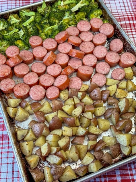 Baking sheet with Kielbasa sausage made in the oven along with roasted potatoes and broccoli on a red and white plaid napkin. Keilbasa Sausage Recipes, Cooking Kielbasa, Sausage Casserole Slow Cooker, Roasted Potatoes And Broccoli, How To Cook Kielbasa, Kielbasa And Potatoes, Kielbasa And Cabbage, Potatoes And Broccoli, Slow Cooker Creamy Chicken