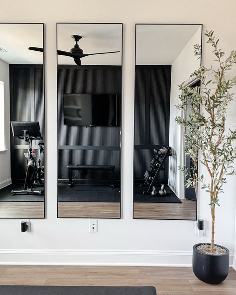 Reeded moulding for a unique take on board and batten in this home gym makeover #homegym #homegymmakeover #roommakeover #diyhousetohome #diytogether #diyaccentwall #accentwall #featurewall #reededwall #blackaccentwall #modernhomedesign #moderninteriors #moderninteriordesign #tricornblack #matteblack #mattefinish #designisinthedetails #interiordetails #itsallinthedetails Diy Gym Mirror Wall, Living Room Gym Combo, Home Gym Accent Wall, Gym Accent Wall, Reeded Moulding, Gym Mirror Wall, Gym Makeover, Living Room Gym, Modern Gym