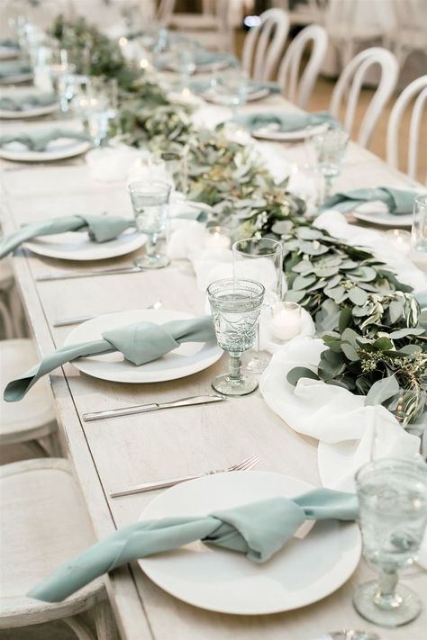 How beautiful is this muted seafoam green table setup?! The simple knotted napkins match perfectly with these gorgeous intricate goblets and the garland running down the middle of the table pulls it all together. #receptiontableideas #weddingreception #weddingtable Knotted Napkins, Seafoam Green Wedding, Green Wedding Reception, Seafoam Wedding, Glass Table Decor, Sea Glass Wedding, Wedding Reception Themes, Wedding Table Setup, San Luis Obispo Wedding