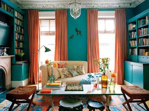 Living In Color, Hamilton Design Associates | Remodelista Architect / Designer Directory Transitional Family Room, Mismatched Furniture, Turquoise Room, Blue Sectional, Orange Curtains, Ceiling Fan Bedroom, Turquoise Walls, Teal And Orange, Living Room Orange