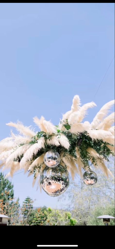 DIY overhead dance floor installation. Disco Balls And Pampas, Disco Pampas, Disco Ball Outdoor, Ceiling Display, Reception Ceiling, Coachella Theme, Diy Disco Ball, Disco Ball Decorations, Disco Ball Decor