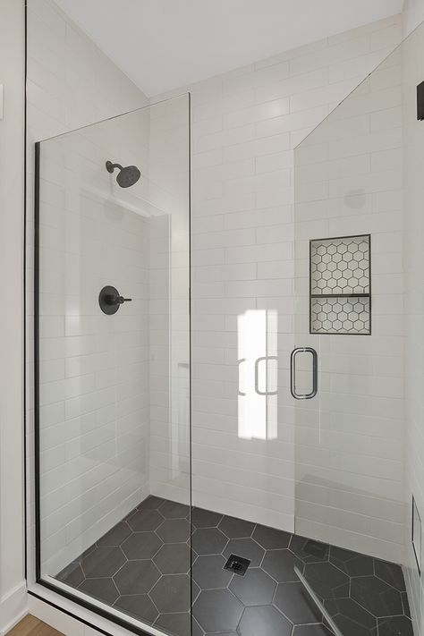 Spare Bathroom Tile Ideas, White Tile Shower With Black Floor, White Shower With Black Floor, Shower With Black Floor, Walk In Shower Black Fixtures, Master Shower Black And White, Black And White Master Bath, White Subway Tile Shower Black Fixtures, Madrid House