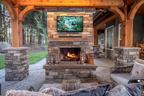 Outdoor Wood Burning Fireplace | HGTV Stained Wood Beams, Outdoor Stone Fireplaces, Outdoor Wood Burning Fireplace, Outdoor Fireplace Kits, Fireplace Kits, Rustic Landscape, Outdoor Fireplace Designs, Outdoor Gas Fireplace, Outdoor Fireplace Patio