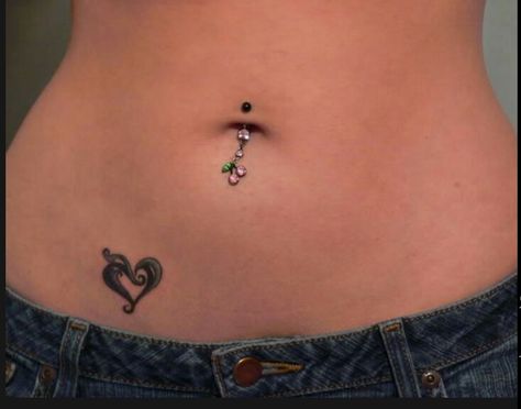 My cherry belly ring Heart Tattoo On Stomach, Heart Tattoo Waist, Heart Stomach Tattoo, Under Stomach Tattoo, Heart Tattoo Stomach, Under Belly Button Tattoo, Heart Hip Tattoo, Black Women Tattoos Ideas, Tattoos Above The Knee