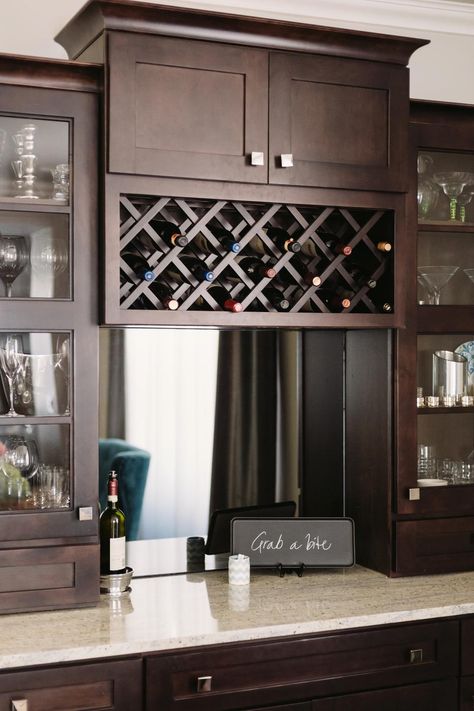 This clever china cabinet not only has room for glasses and dishware. It also features a wine rack, a mirror and an elegant granite countertop that can double as a buffet. A chalkboard lets hosts inject personality into the scene. Maple Cabinet Kitchen, Brown China Cabinet, Cabinet With Wine Rack, Coastal Craftsman, Maple Cabinet, Wine Storage Cabinets, Home Bar Cabinet, Maple Cabinets, Home Bar Designs