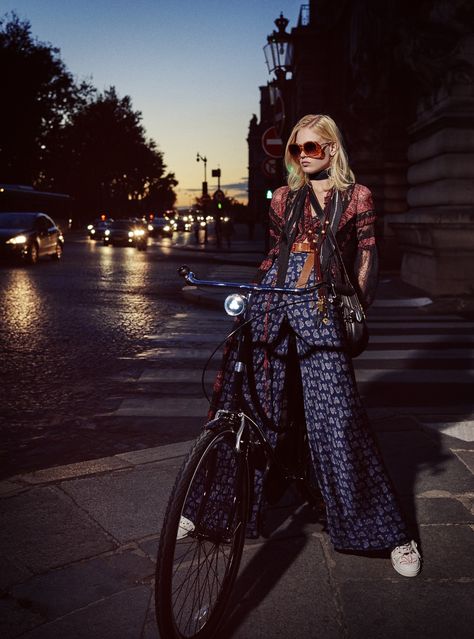 Silk and lace dress, price on request, cotton bra top, $440, printed pants, $1,280, all, ETRO, collection at Saks Fifth Avenue stores nationwide. Sunglasses, WILDFOX SUN, $189. Gold-plated brass earrings, AURÉLIE BIDERMANN, $555. Silk scarf, ROCKINS LONDON, $200. Rope, wood, and brass necklace, CHLOÉ, $690. Leather belt, DRIES VAN NOTEN, price on request. Calfskin handbag, COACH, $695. Embellished printed canvas sneakers, MARC JACOBS, $395. Carbon fiber bicycle, HERMÈS, price on request. ... Night Fashion Editorial, Urban Editorial, David Burton, Bike Fashion, Bicycle Chic, Night Fashion, Elle Us, Alfred Stieglitz, Cycle Chic