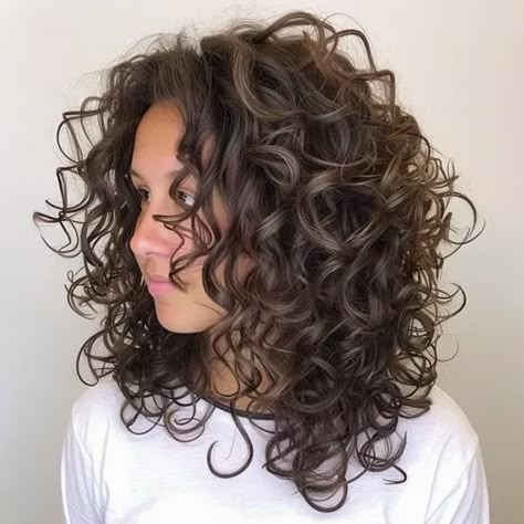 "Get Ready to Slay with 28 Irresistible Curly Hair Styles! Unlock the Secrets to Effortless Elegance. Click Now. Big Curls Perm For Medium Hair, Armpit Length Curly Hair, Short Layer Curly Hair, Classic Shag Haircut, Body Perms For Medium Length Hair, Fine Curly Hair Cuts Shoulder Length, Shoulder Length Wavy Haircut, Low Density Curly Hair Cuts, Large Curl Perm