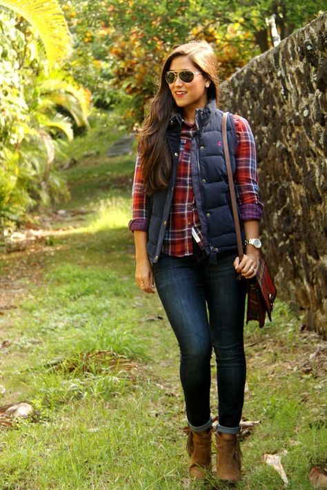 A deep blue quilted vest and navy skinny jeans are a great outfit formula to have in your arsenal. Elevate your getup with brown suede ankle boots.  Shop this look for $273:  http://lookastic.com/women/looks/sunglasses-vest-watch-crossbody-bag-ankle-boots-dress-shirt-skinny-jeans/7585  — Black Sunglasses  — Navy Quilted Vest  — Silver Watch  — Red Plaid Leather Crossbody Bag  — Brown Suede Ankle Boots  — Red Plaid Dress Shirt  — Navy Skinny Jeans Christmas Party Outfit Casual, Wander Outfit, Mode Country, Flannel Shirt Outfit, Casual Party Outfit, Flannel Outfits, Sweatpants Outfit, Winter Dress Outfits, Plaid Shirts