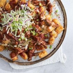 Memphis BBQ Pork Totchos - Allrecipes.com Pork Totchos, Memphis Bbq, Pork Salad, Bar Food, Barbeque Sauce, Pulled Pork Recipes, Tater Tots, Bbq Pork, Coleslaw