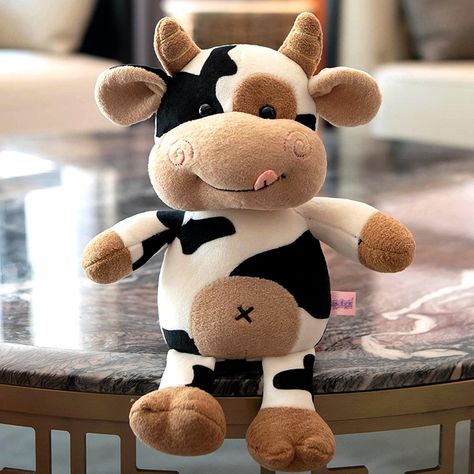 PRICES MAY VARY. DESIGN & CONCEPT: The cow stuffed plush toy has round eyes, fluff-covered body and cute little mouth, making it look very cute and charming, 12 inches size fits your hand! It is lightweight and easy to carry around at any time. Safe and reliable: This plush cow toy is very in line with the safety standards of children's toys. The material is harmless and does not contain harmful substances, so children can safely get close to it. Suitable for All Ages: This fluffy cow stuffed an Cow Stuffed Animal, Fluffy Cow, Doll For Kids, Cow Toys, Cow Plush, Fluffy Cows, Round Eyes, Animal Cute, Toy For Kids