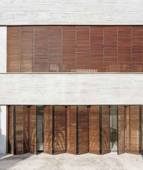 Large wooden shutters filter light and air into Mallorcan home by Company Studio Blind Inspiration, Blinds Inspiration, Stepping Stone Walkways, Accordion Door, Spanish Practice, House Shutters, South Facing Garden, Canopy Shelter, Oak Wood Floors