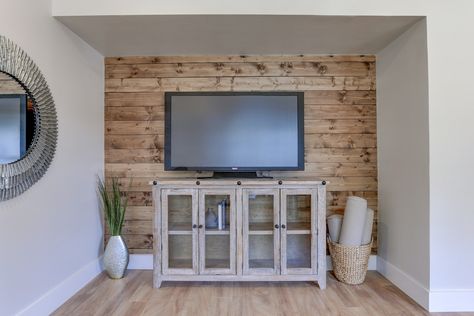 Wood accent wall DIY - 1x6 white pine/common board from Home Depot stained with 1 coat of Minwax Special Walnut and installed with a nickel gap for a shiplap look - cost about $250 including materials and install Wood Shiplap Accent Wall, Pine Shiplap Wall Living Room, Stained Shiplap Wall Living Room, Knotty Pine Accent Wall, Pine Accent Wall, Stained Wood Accent Wall, Stained Shiplap Wall, Pine Shiplap Wall, Raw Wood Shiplap Walls