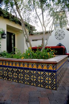 Once you've found a place that catches your eye, .               http://www.reddeerhomesearch.com/ Tiled Planter, Colonial Patio, Mexican Courtyard, Spanish Patio, Mediterranean Courtyard, Spanish Courtyard, Mediterranean Patio, Texas Garden, Beautiful Landscaping